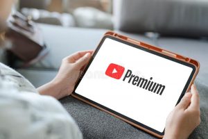 woman-watching-youtube-premium-ipad-youtube-premium-enjoy-ad-free-access-downloads-background-play-youtube-187699436