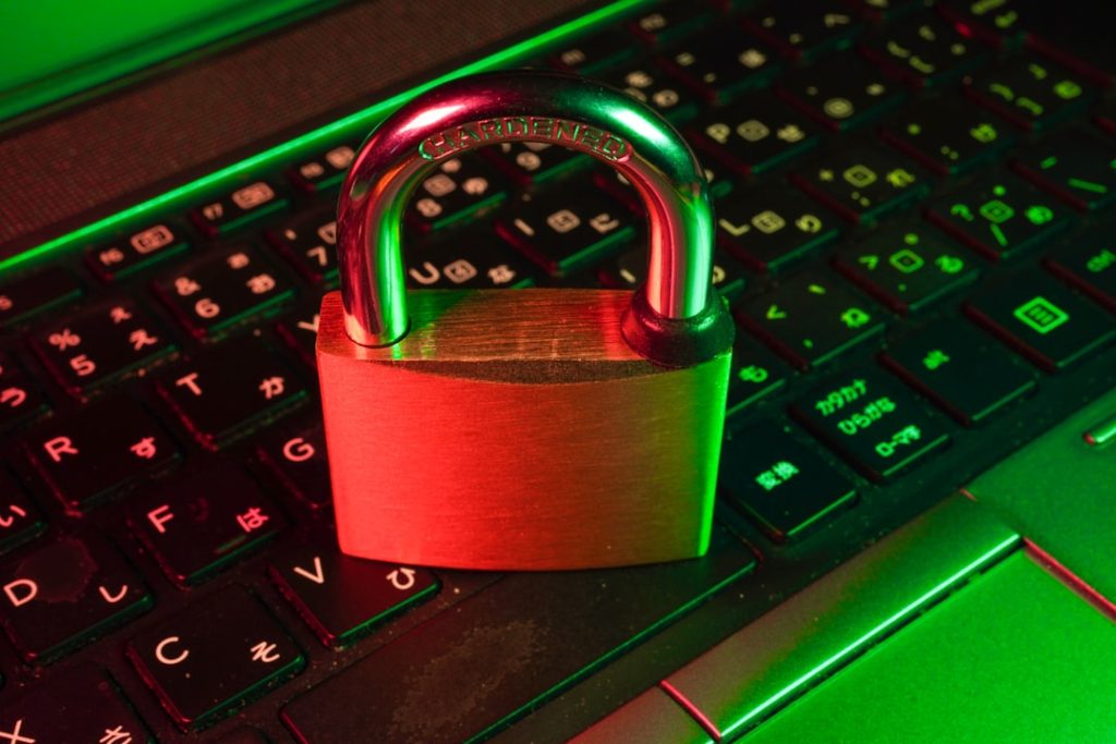 A padlock resting on a keyboard, symbolizing security and privacy