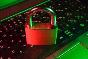 A padlock resting on a keyboard, symbolizing security and privacy